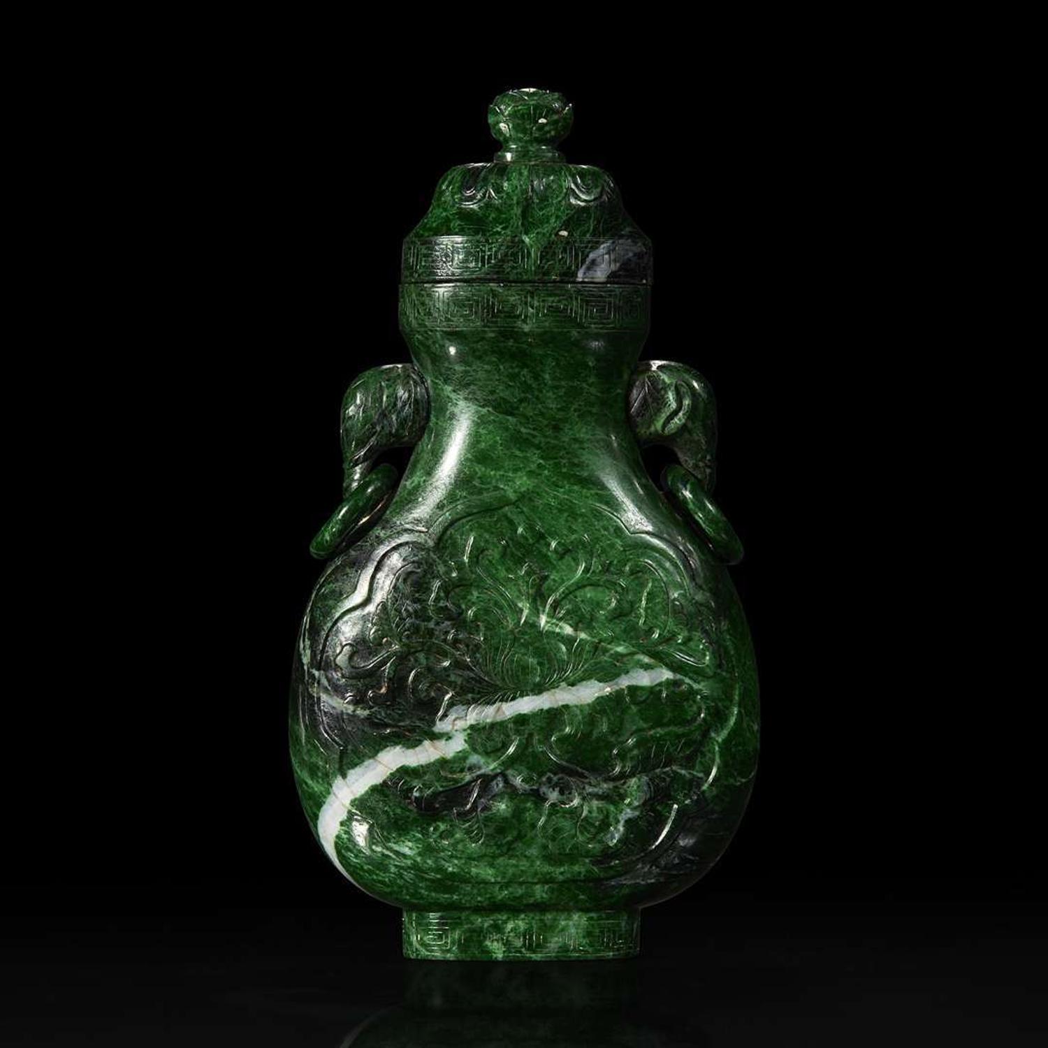 A Chinese carved chloromelanite vase and cover 玉盖罐