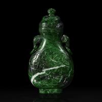 A Chinese carved chloromelanite vase and cover 玉盖罐