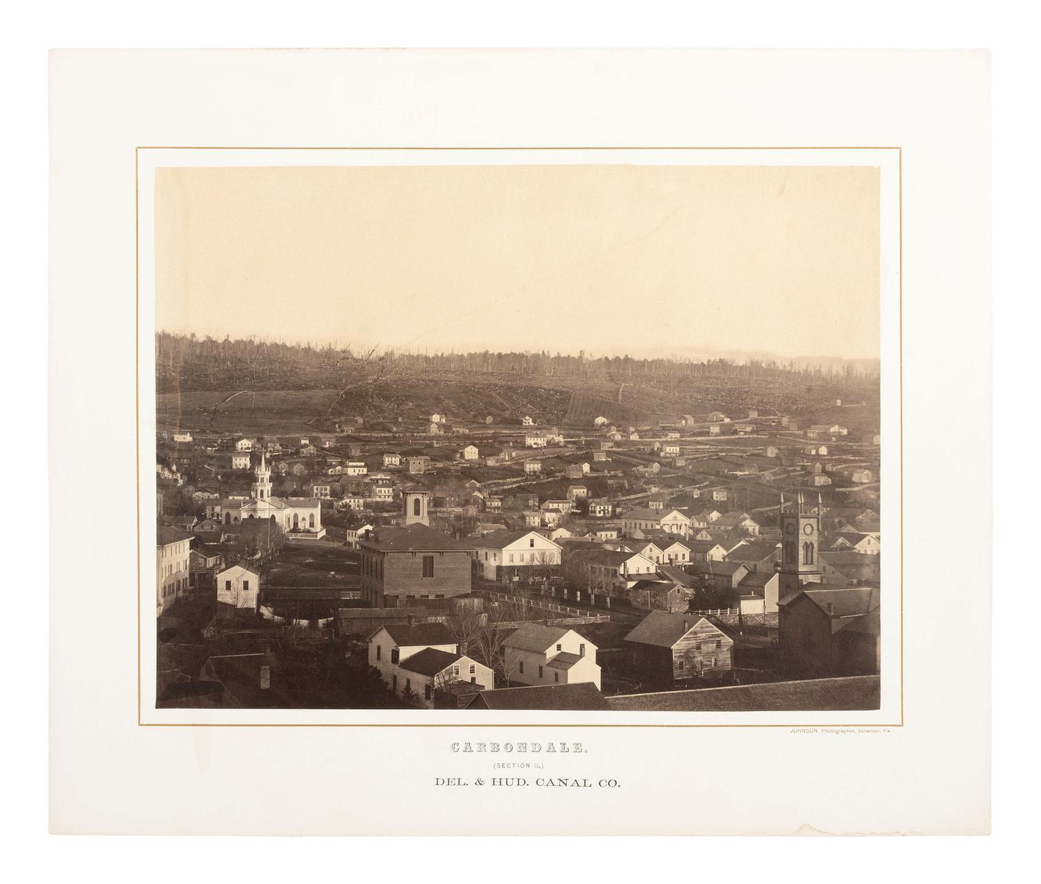 Pennsylvania JOHNSON, Thomas H. (b. 1821), photographer. Exceptional 3-section panoramic view of Carbondale, PA. Ca 1863-1865.