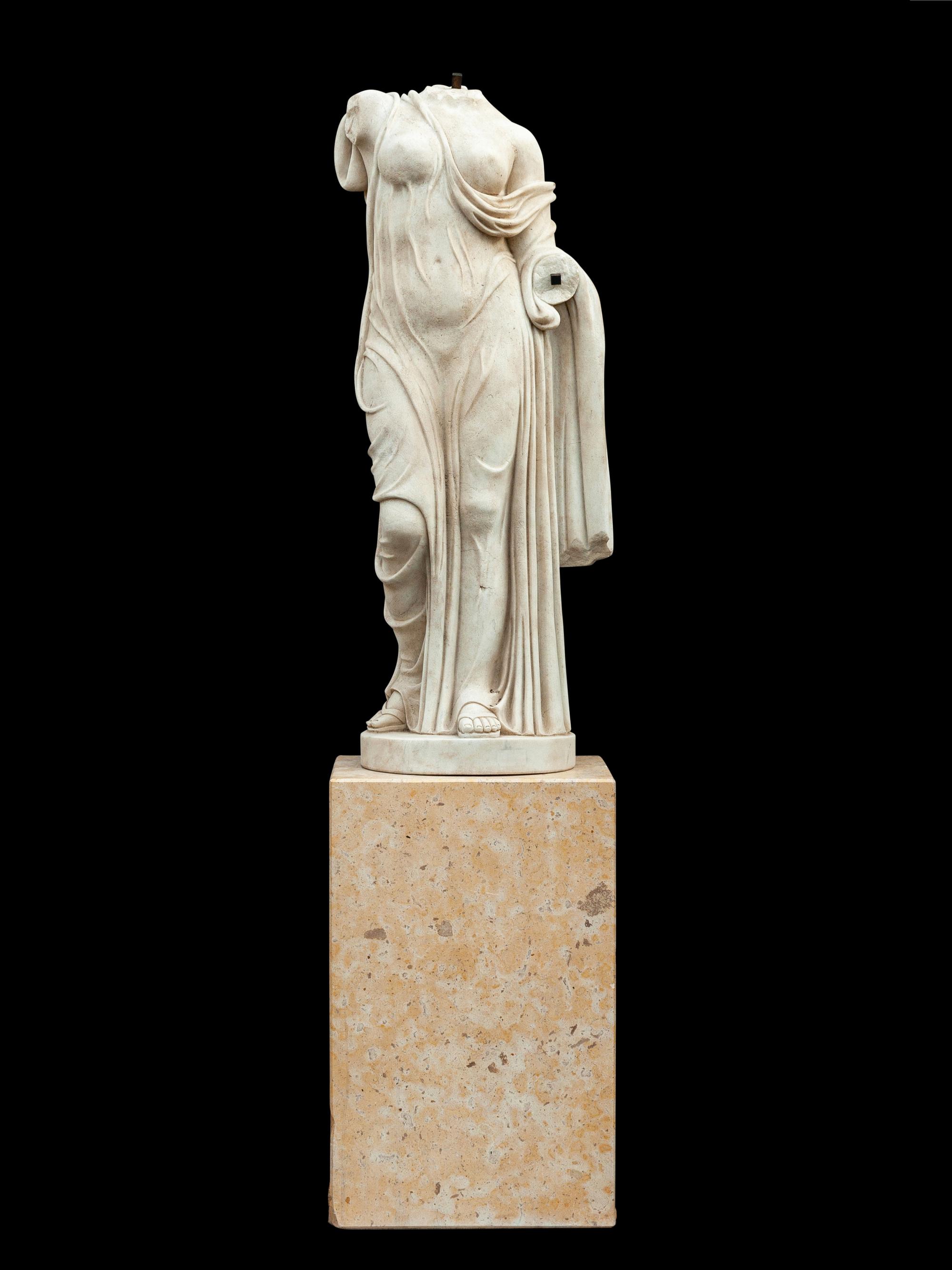 An Italian Carved Marble Torso of a Woman