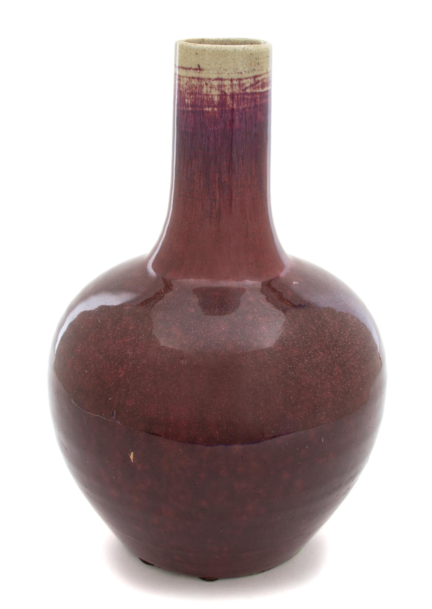 A Chinese Sang de Boeuf Glazed Bottle-form Vase Height 12 x diameter 7 inches. — LATE 18TH/EARLY 19TH CENTURY