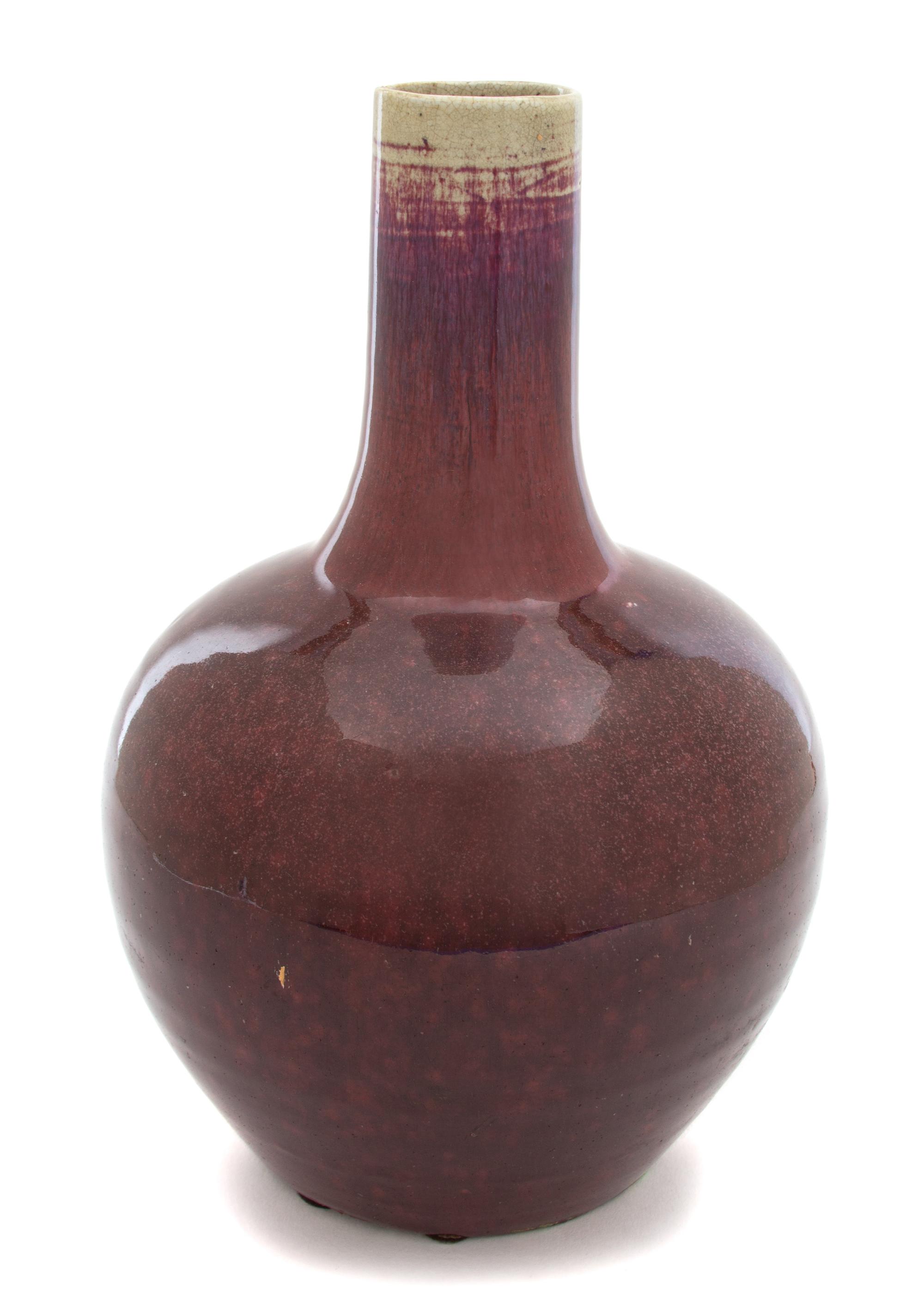 A Chinese Sang de Boeuf Glazed Bottle-form Vase Height 12 x diameter 7 inches. — LATE 18TH/EARLY 19TH CENTURY