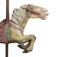 A Carved and Polychrome Painted Jumper Carousel Horse