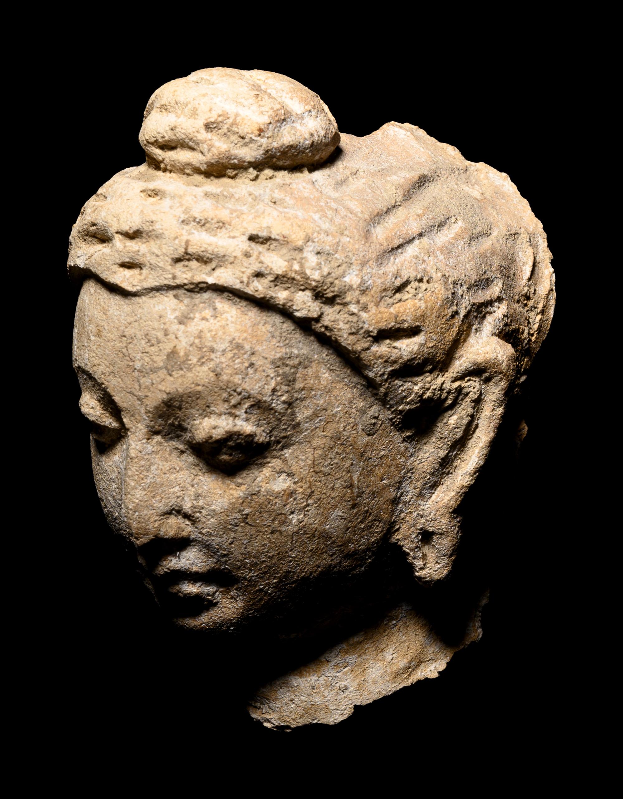 Four Gandharan Fragmentary Stucco Heads and One Bust