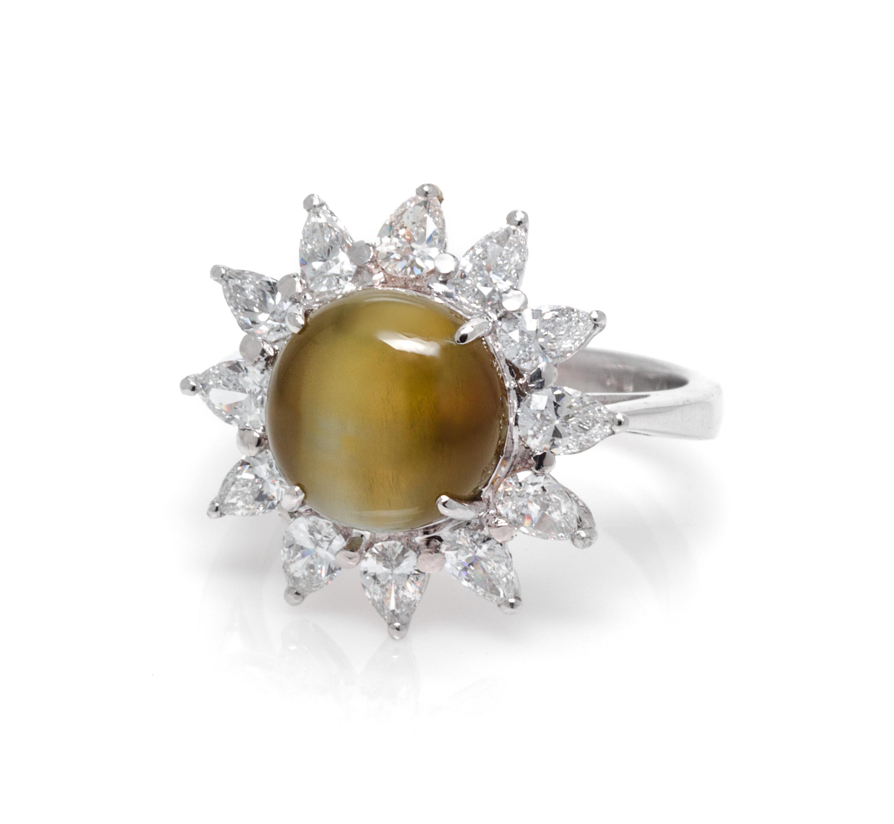 A Platinum, 18 Karat White Gold, Cat's Eye Chryosberyl and Diamond Ring, 5.90 dwts.