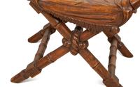 A Continental Carved Walnut X-form Stool