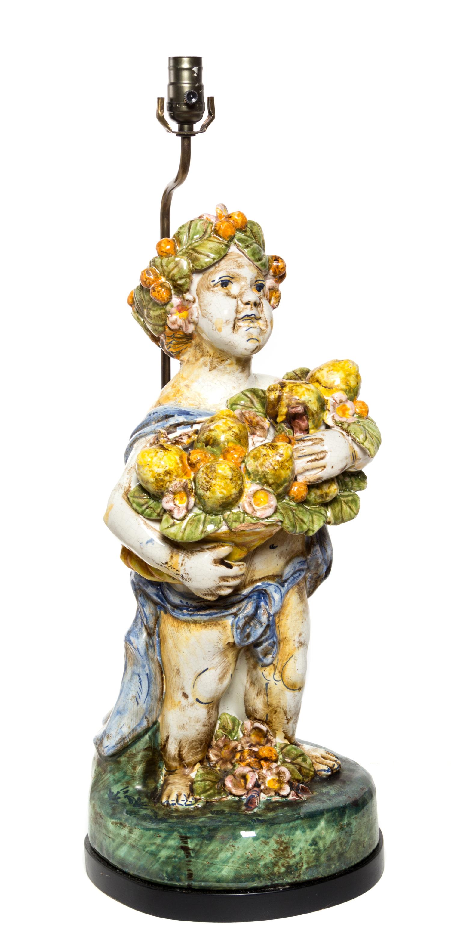 An Italian Majolica Figure Height overall 29 1/4 inches.