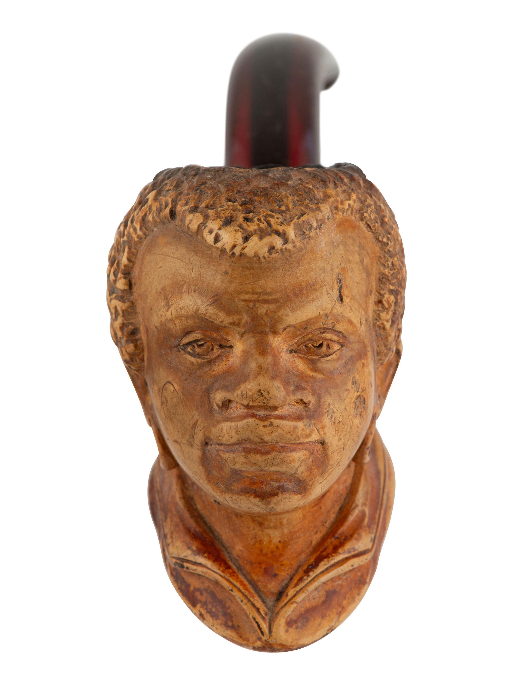 [AFRICAN AMERICANA] Meerschaum pipe carved in the likeness of a Black man. Aussprung, Philadelphia.