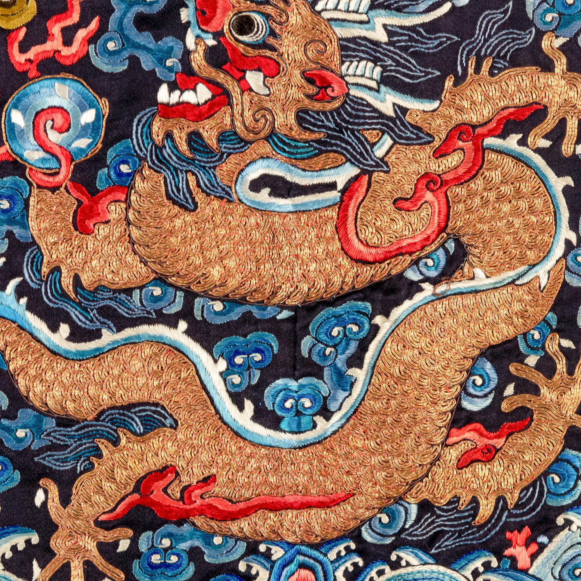 A Chinese Dark Navy Ground Embroidered Silk 'Dragon' Robe, 19th Century 清晚期 石青緞繡八團五爪龍褂