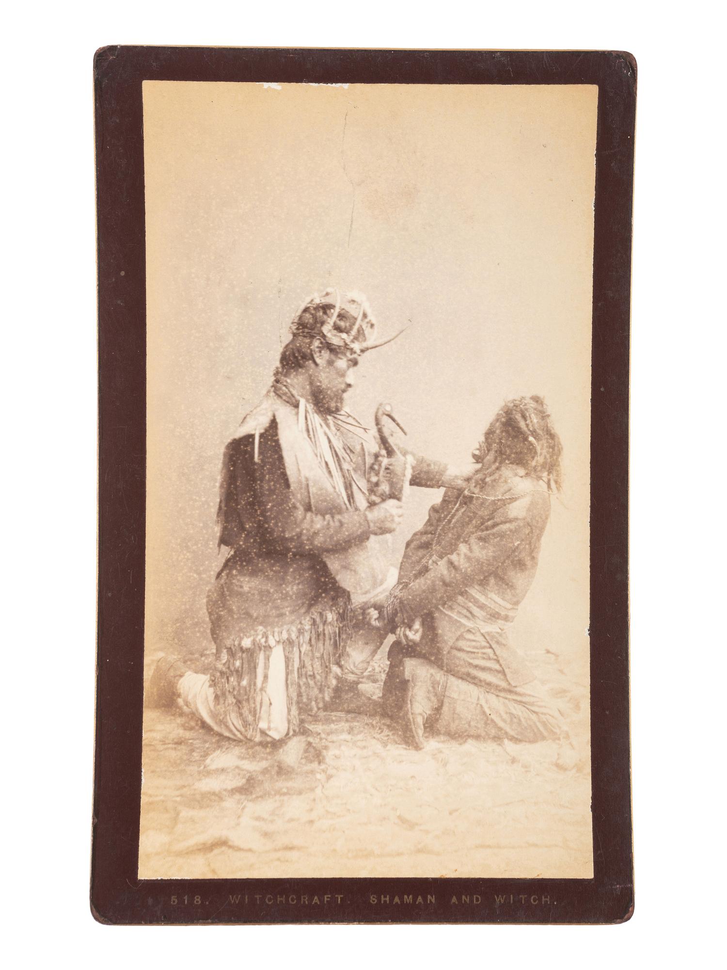 [NATIVE AMERICANS]. DE GROFF, Edward, photographer. Boudoir card featuring a Haida shaman and witch. Sitka, AK: [ca 1890].