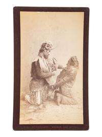 [NATIVE AMERICANS]. DE GROFF, Edward, photographer. Boudoir card featuring a Haida shaman and witch. Sitka, AK: [ca 1890].