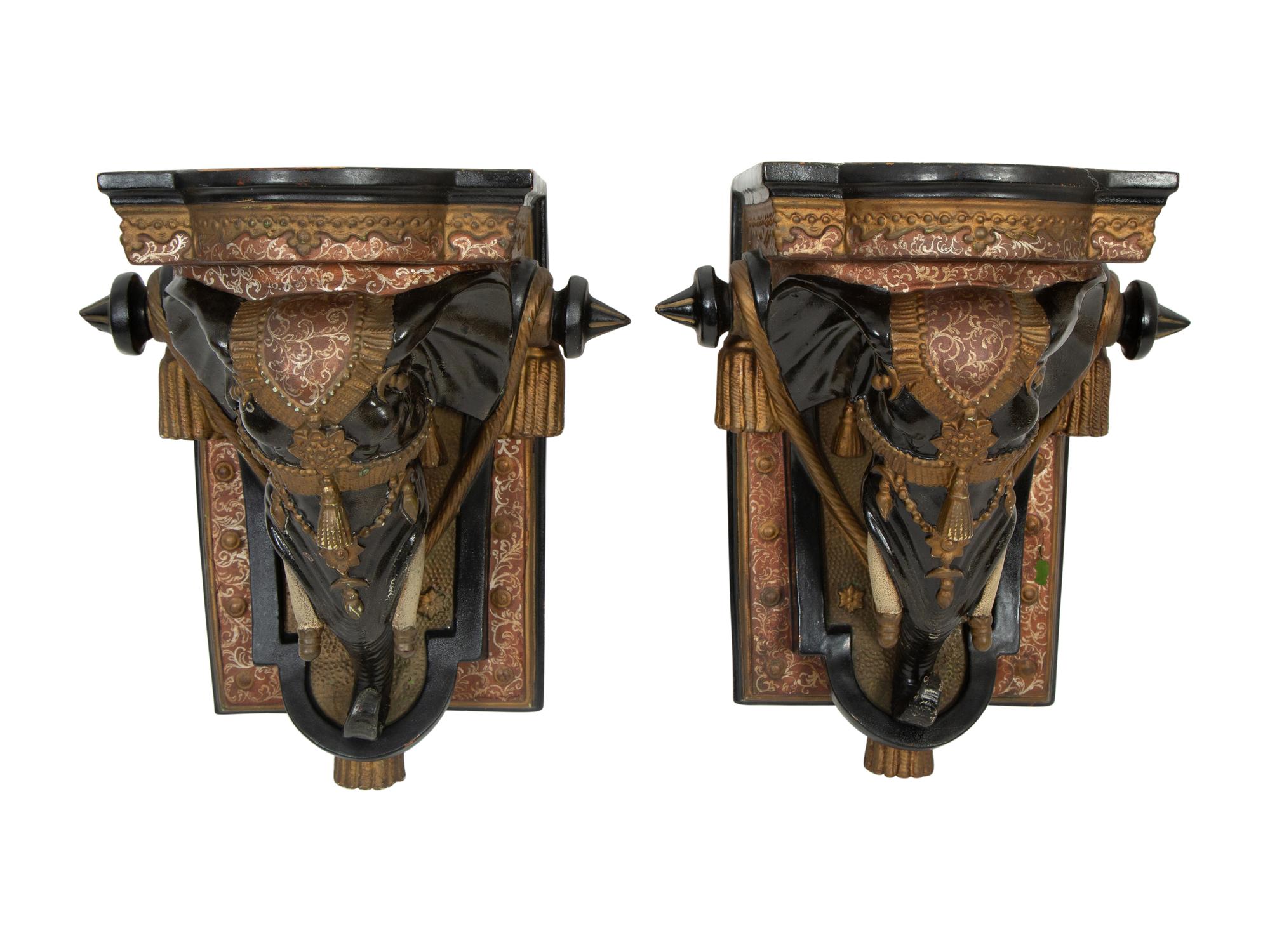 A Pair of Painted and Parcel Gilt Earthenware Elephant-Form Wall Brackets