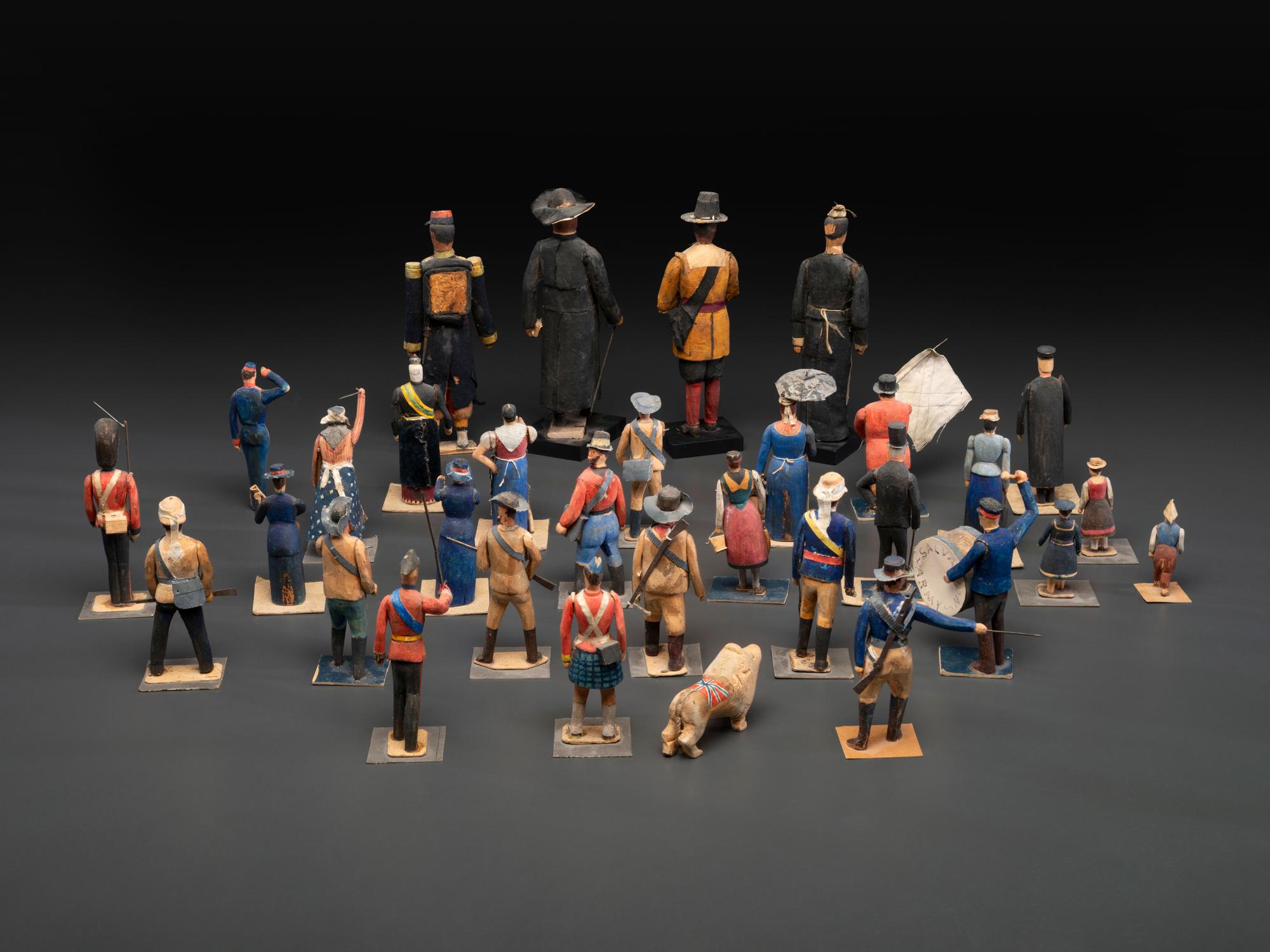 A Collection of Folk Art Carved and Painted 'English Parade' Figures