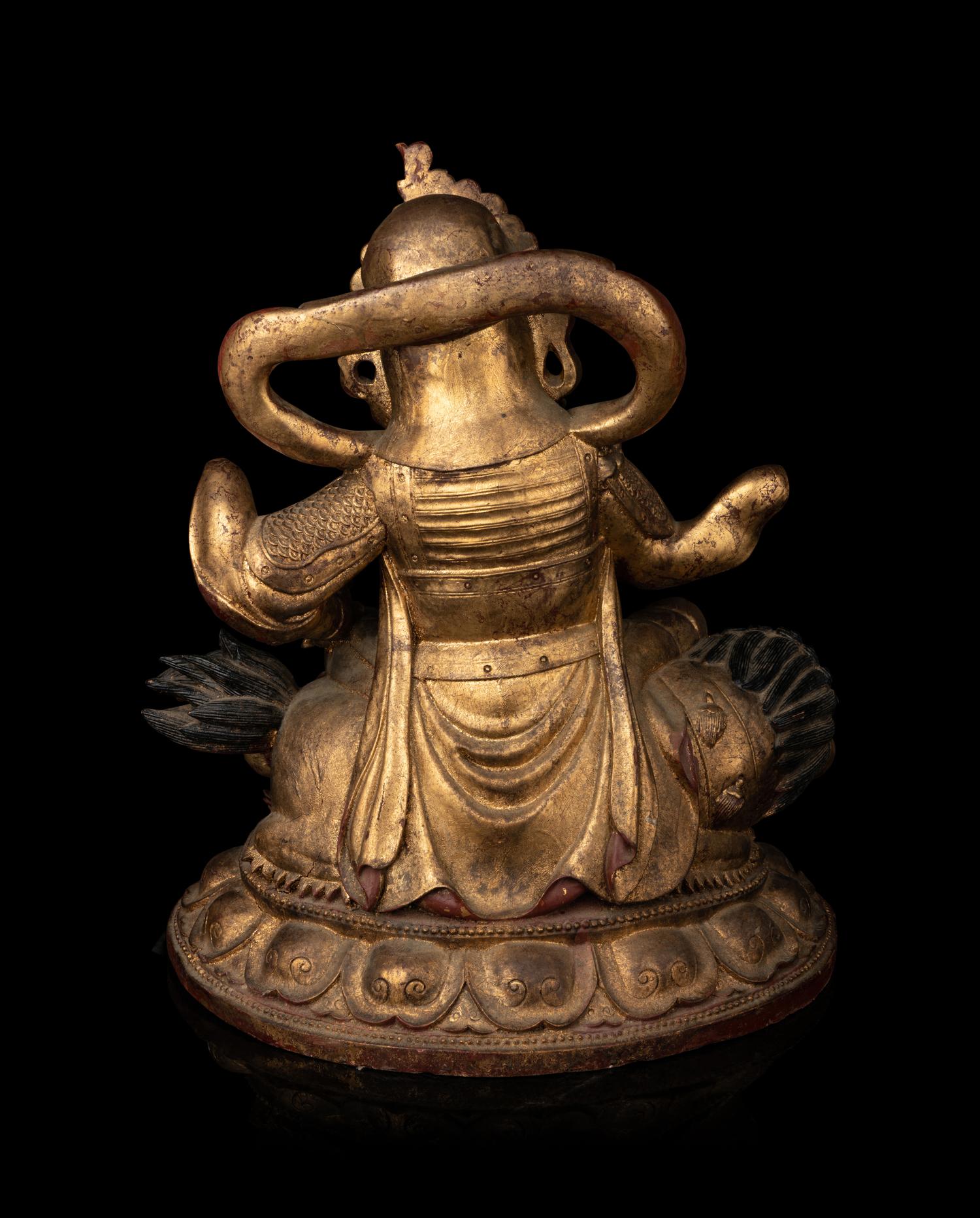A Large and Rare Sino-Tibetan Gilt Lacquer Wood Figure of Vaishravana