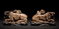 A Pair of Chinese Brown Hardstone 'Ox and Herd' Figural Groups
