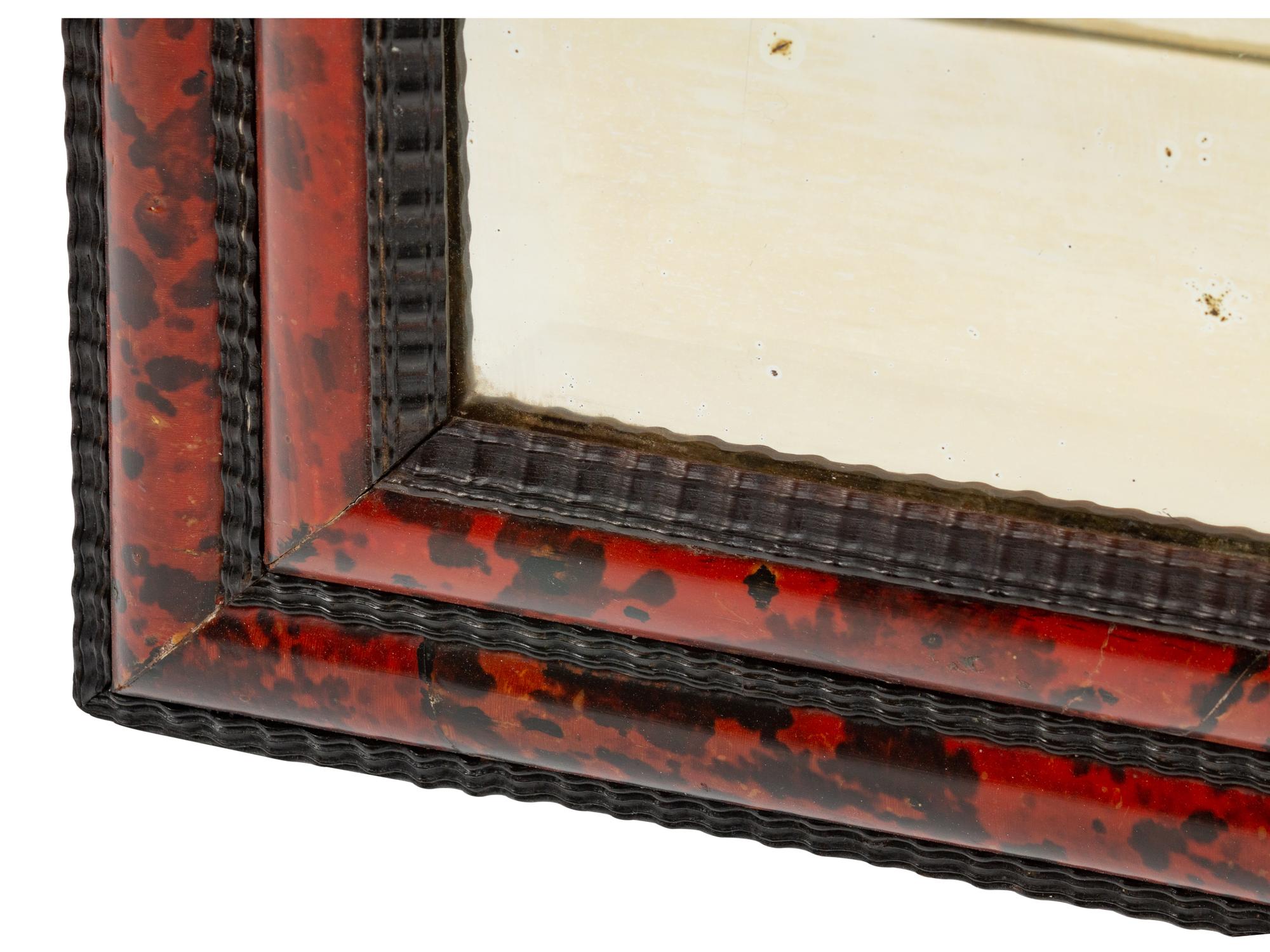 A Flemish Baroque Style Faux Tortoise and Ebonized Wood Mirror