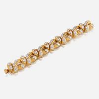 A gold, diamond, and platinum bracelet