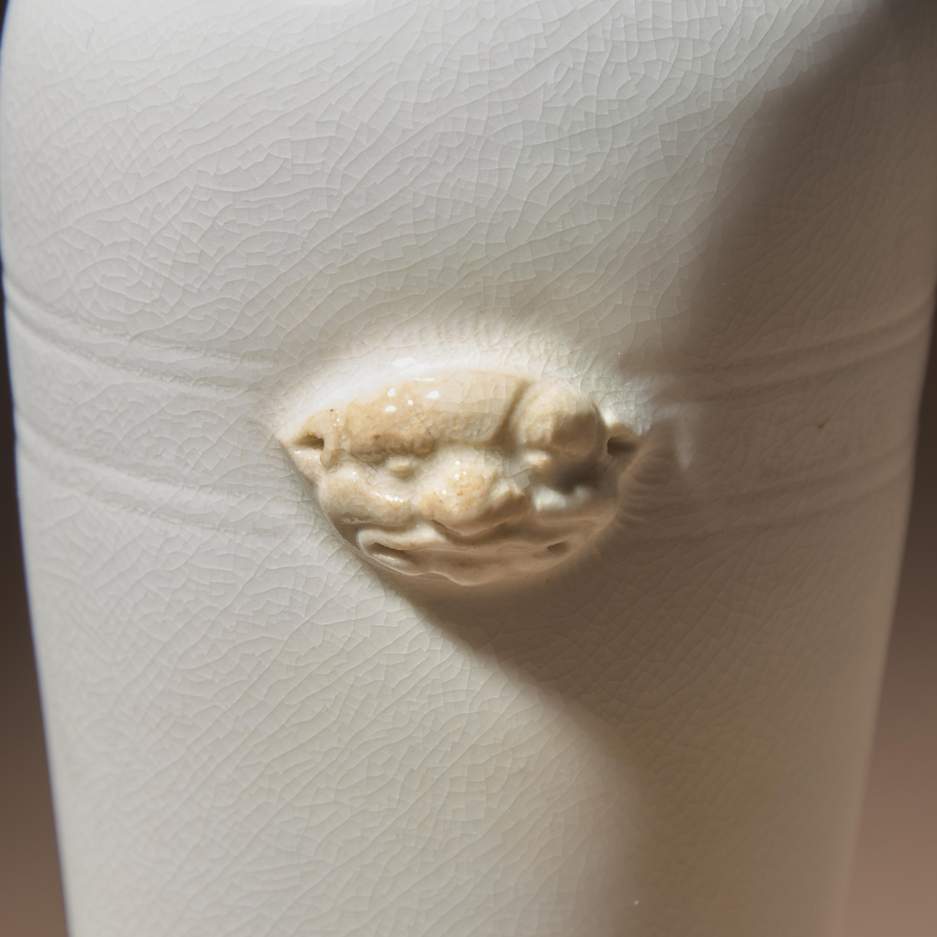 A Chinese Blanc-de-Chine Porcelain Sleeve Vase, 17th-18th Century — 清早期 德化白瓷雙輔首耳弦紋筒瓶