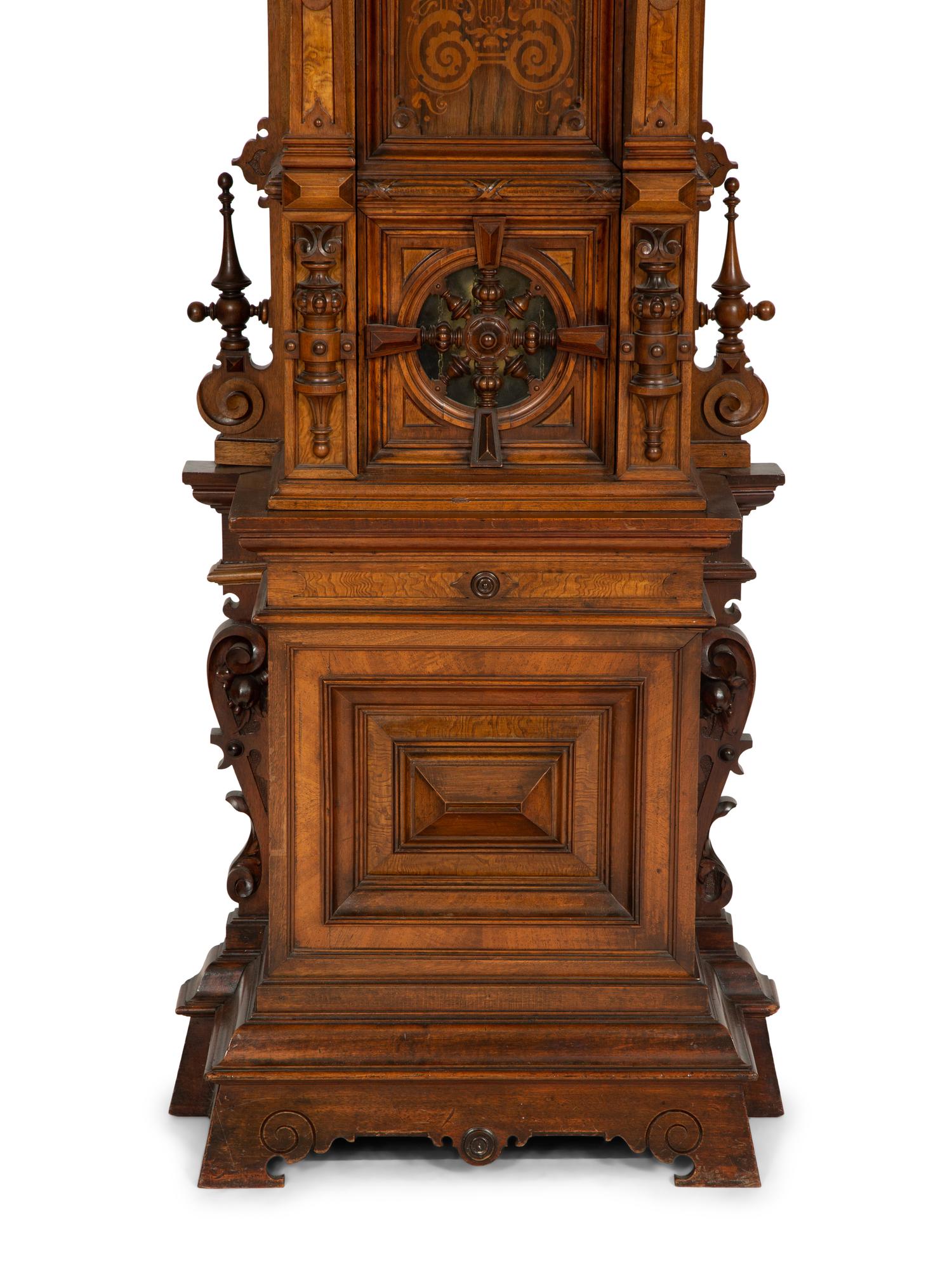 A German Carved Walnut and Marquetry Tall Case Clock