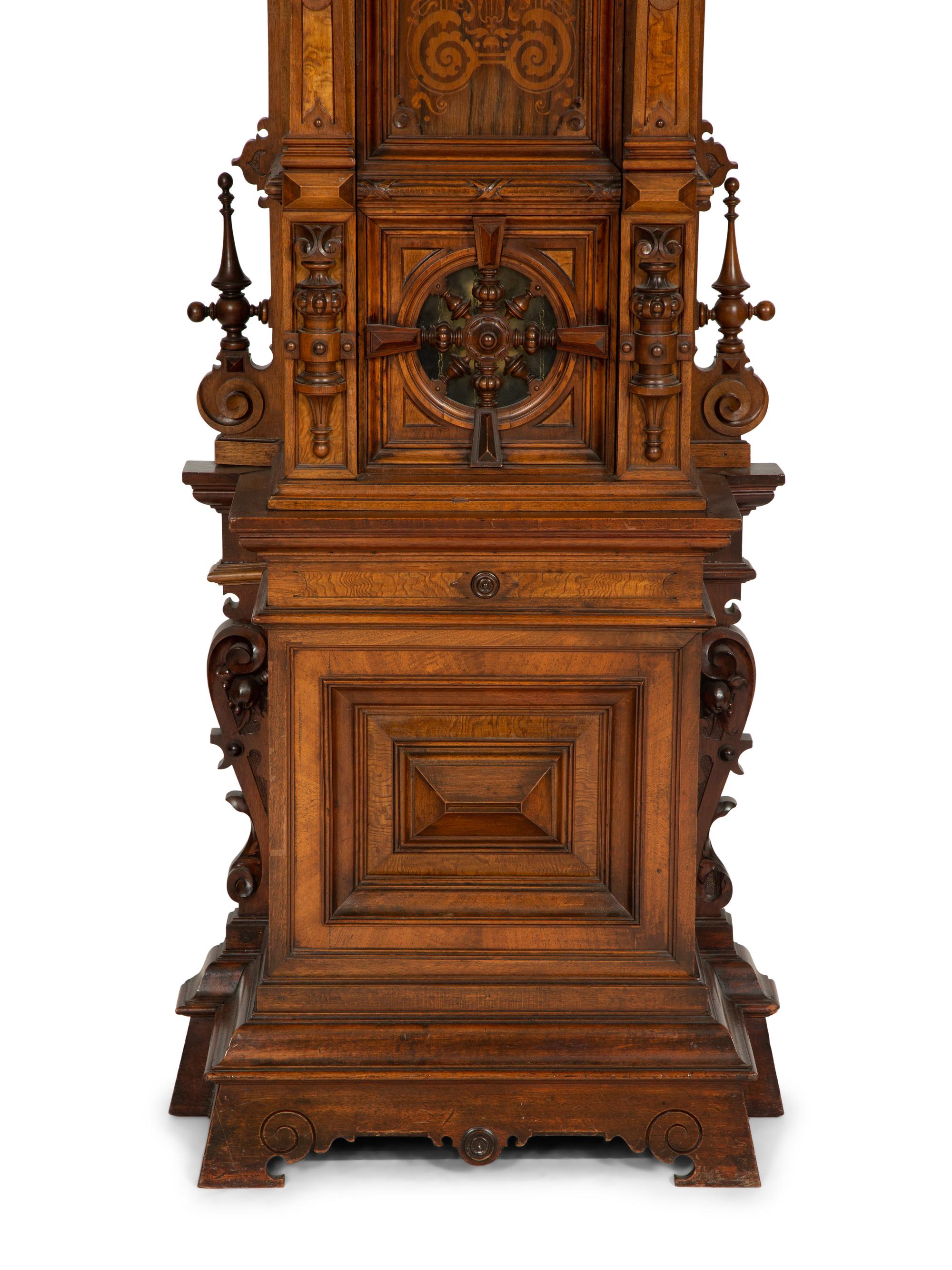 A German Carved Walnut and Marquetry Tall Case Clock