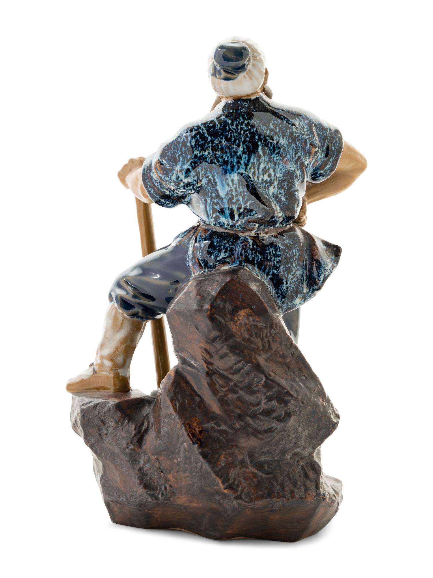 A Chinese Ceramic Figure of a Man
