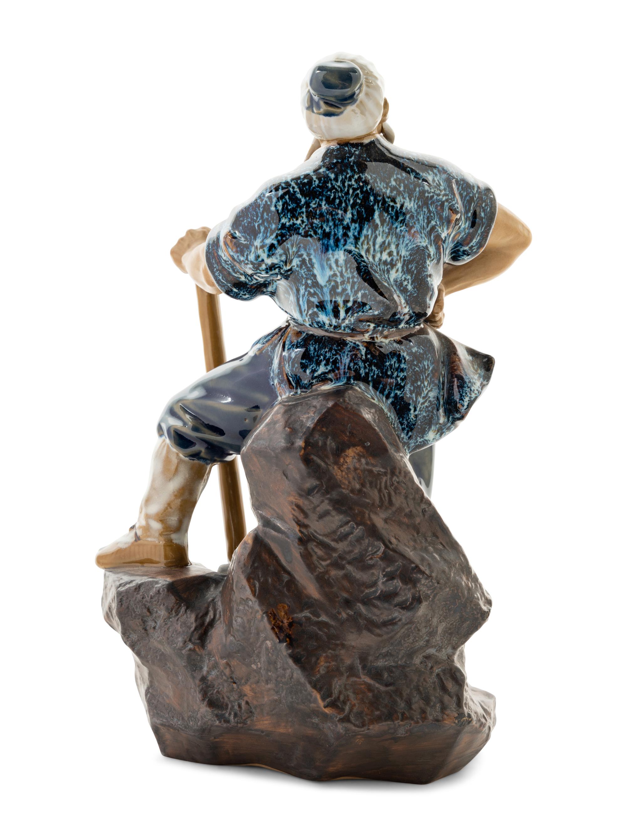A Chinese Ceramic Figure of a Man
