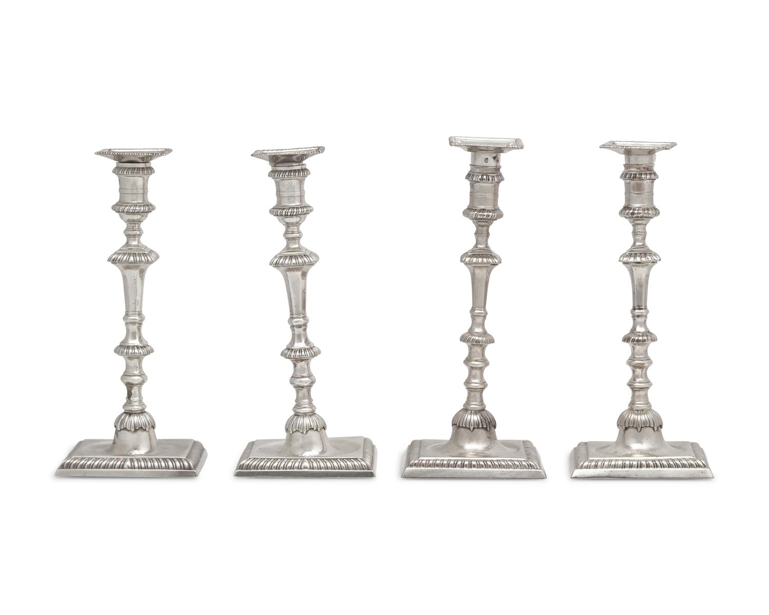 An Assembled Set Of Four George III Sterling Silver Candlesticks