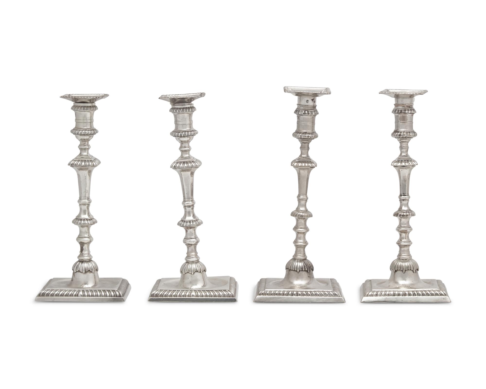 An Assembled Set Of Four George III Sterling Silver Candlesticks