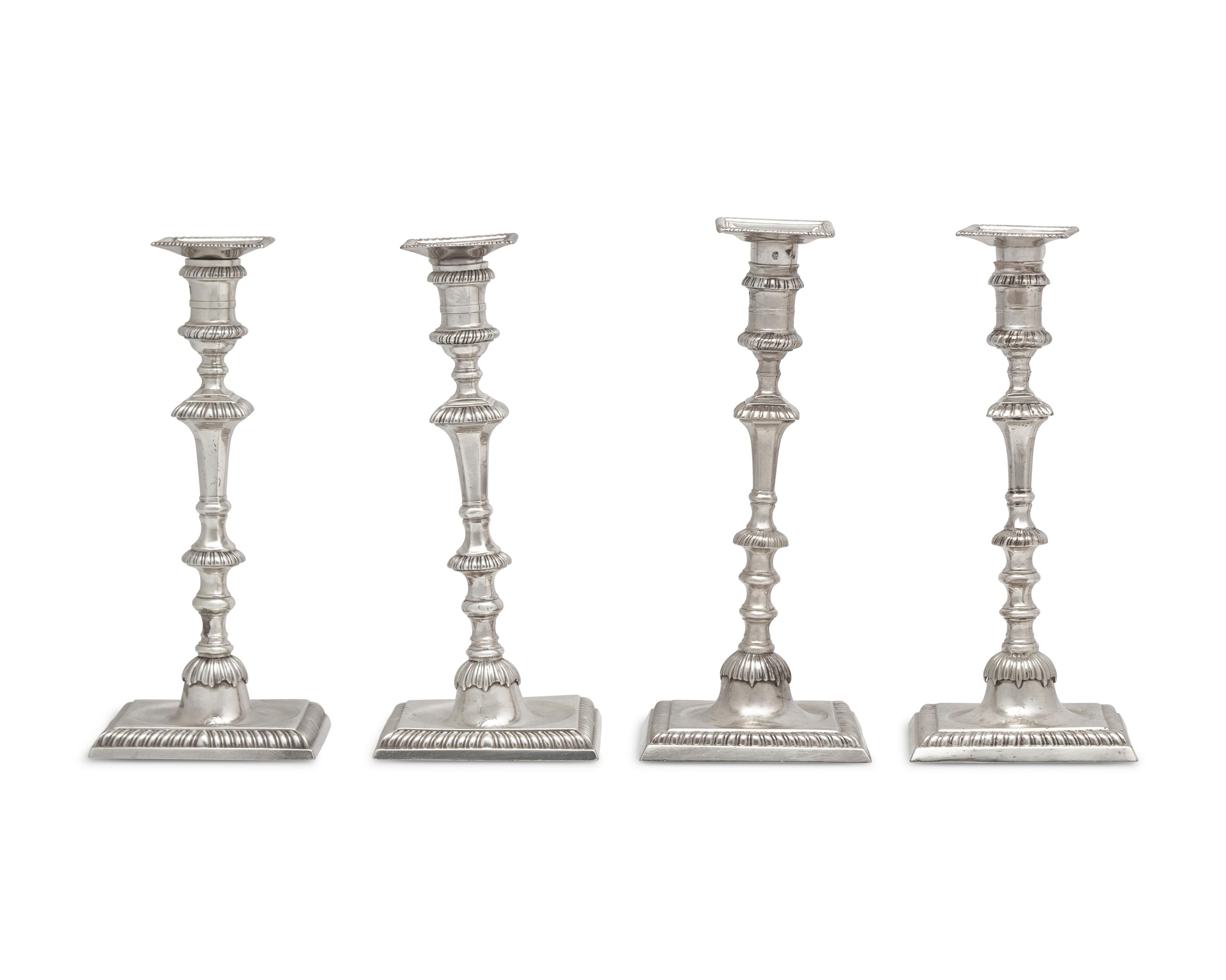 An Assembled Set Of Four George III Sterling Silver Candlesticks