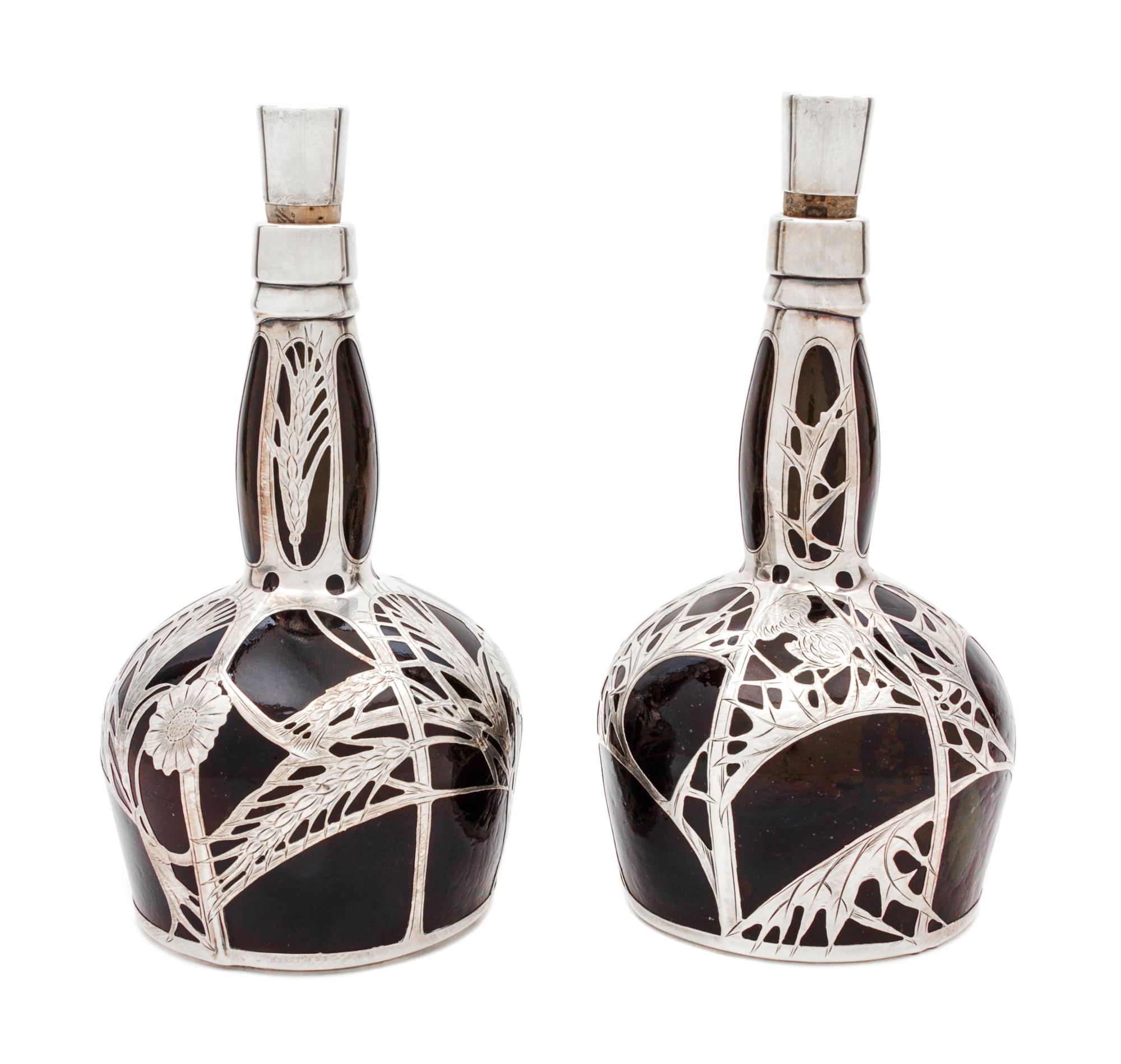 A Pair of Silver Overlay Glass Decanters Height 9 5/8 inches.