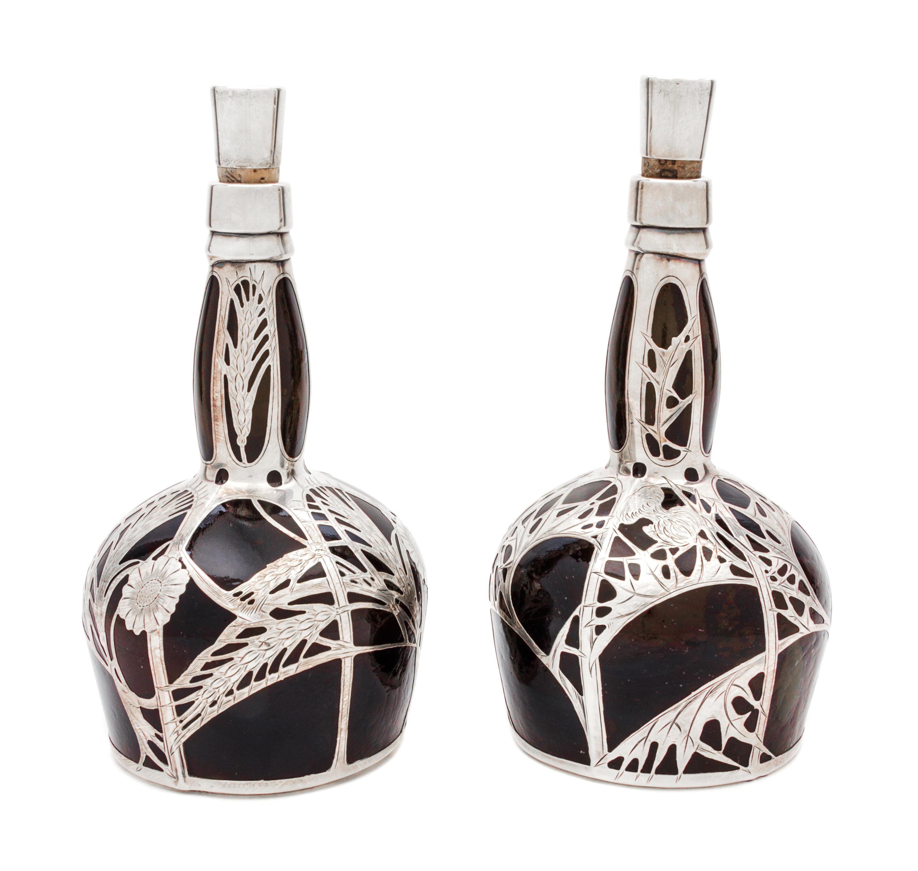 A Pair of Silver Overlay Glass Decanters Height 9 5/8 inches.