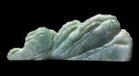 A Chinese Apple Green and Pale Celadon Jadeite Mountain-Form Brush Rest, Bijia