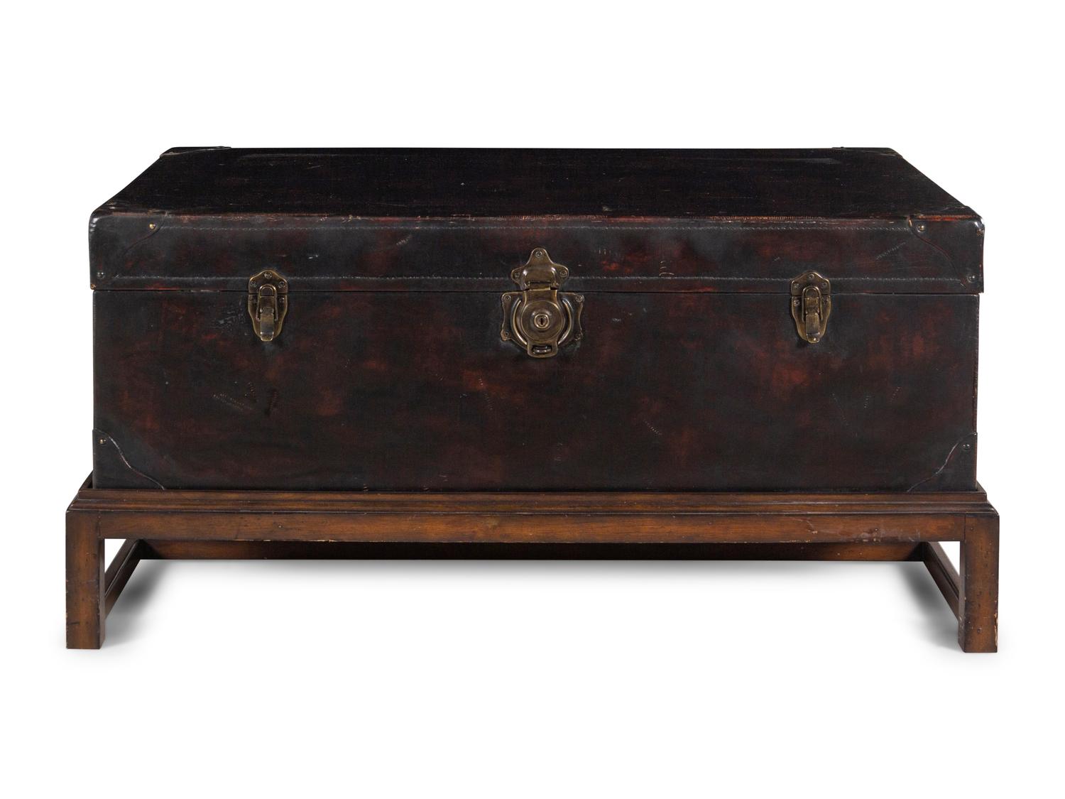 A Leather-Veneered Trunk on a Later Stand