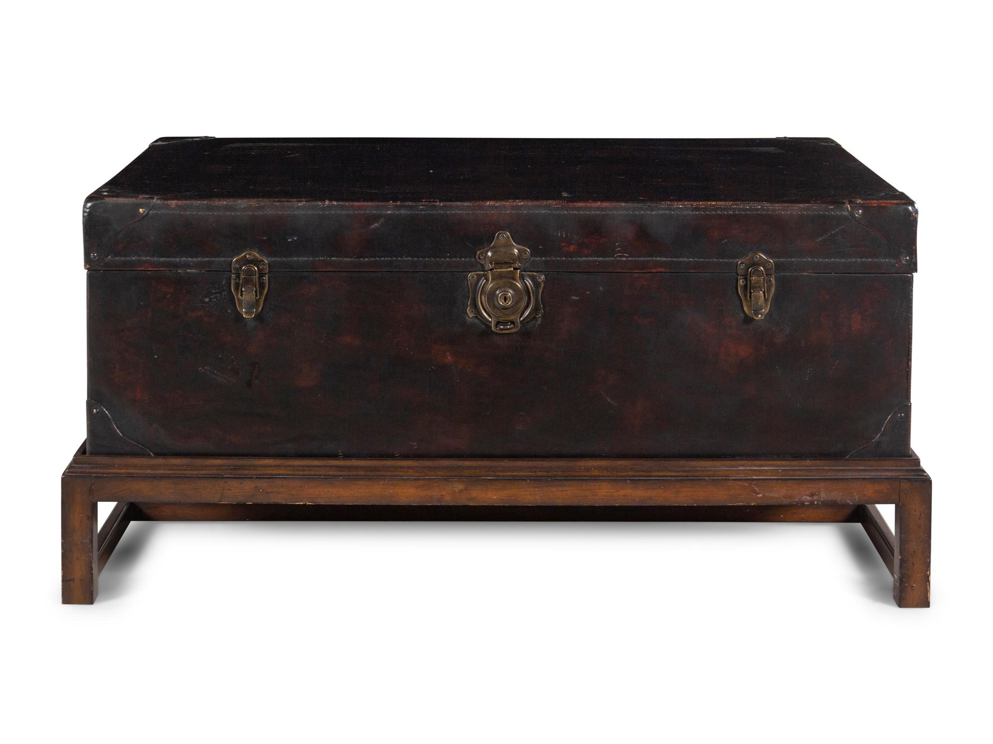 A Leather-Veneered Trunk on a Later Stand