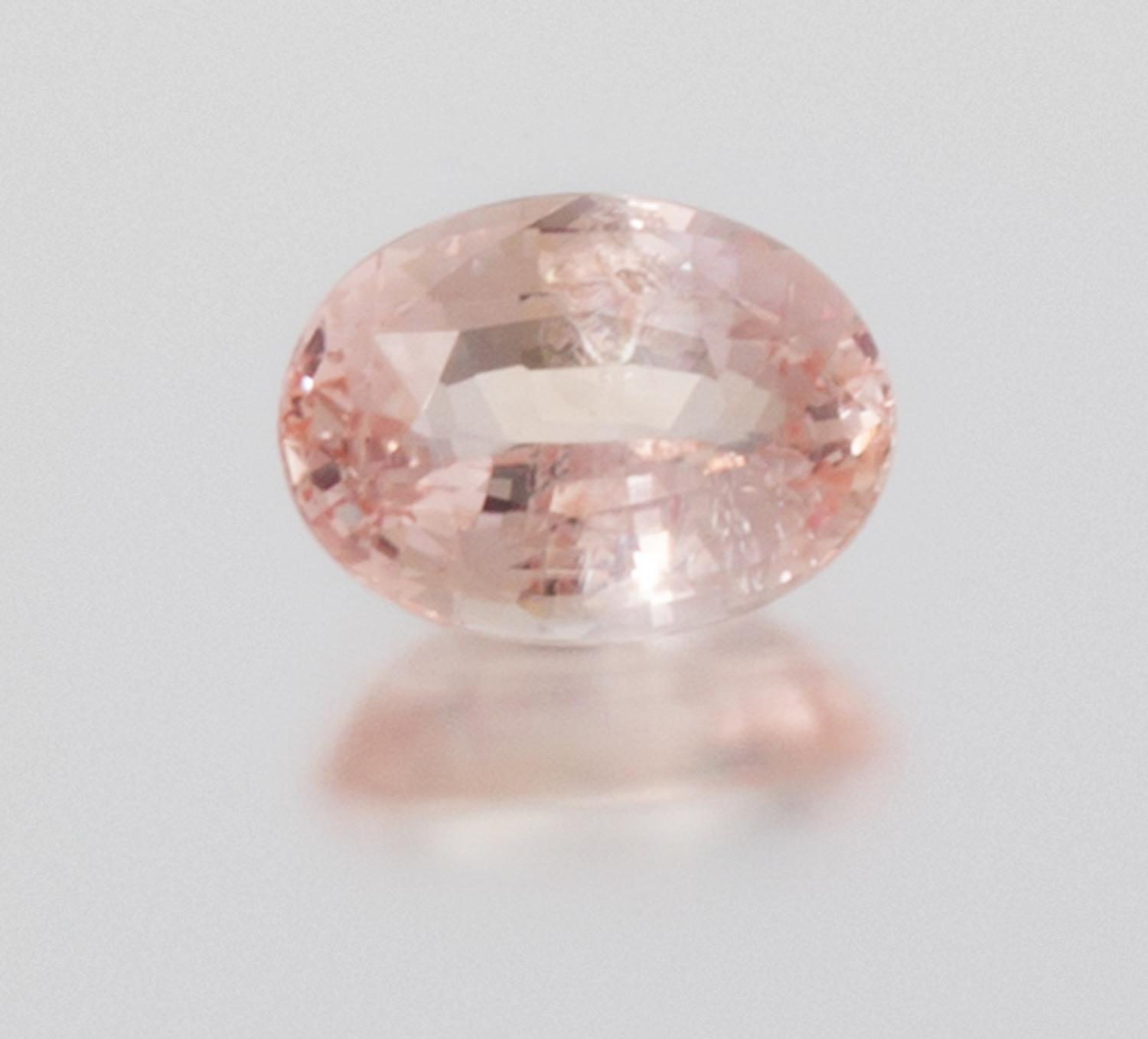 A 6.56 Carat Oval Mixed Cut Padparadscha Sapphire,