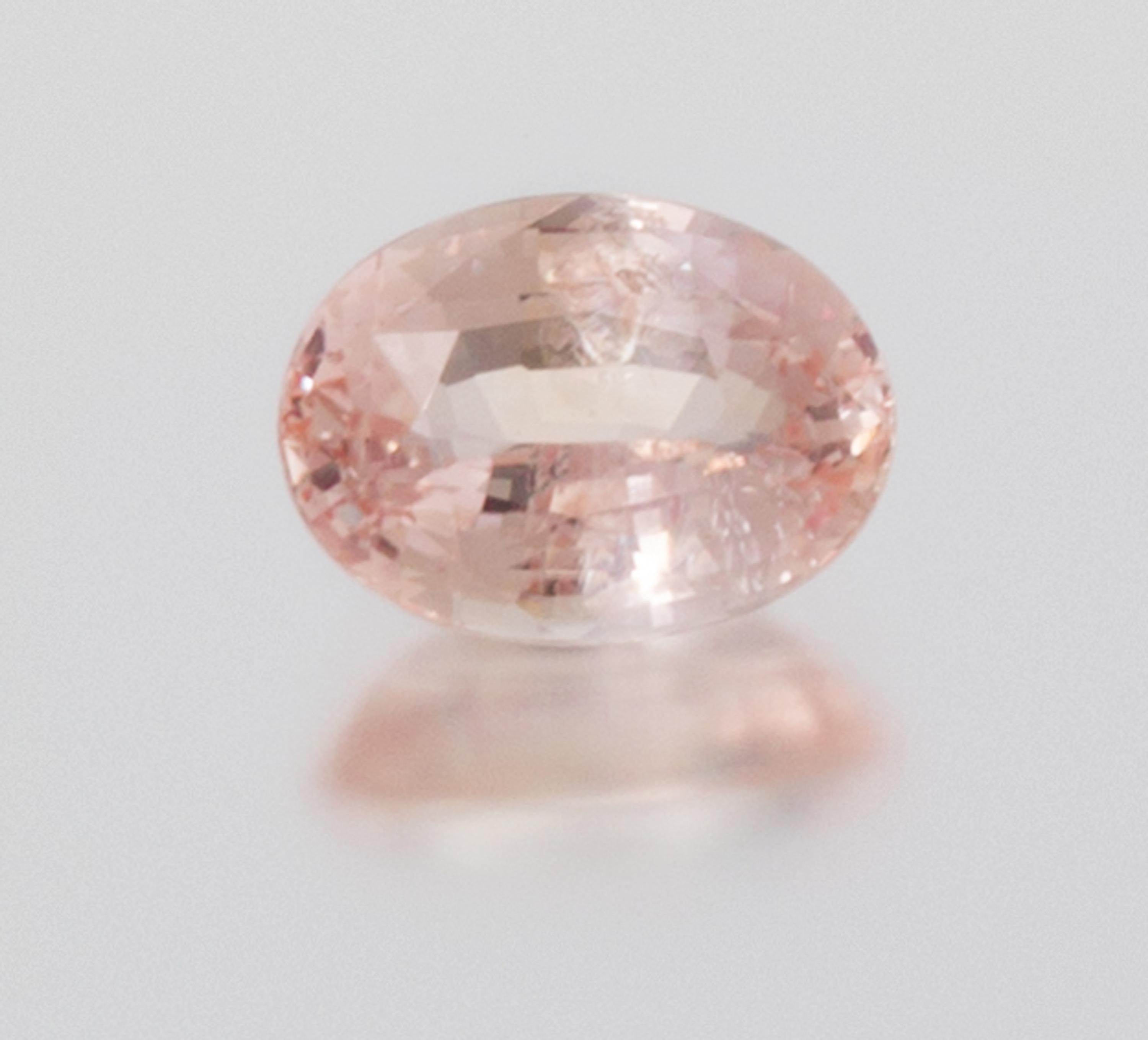 A 6.56 Carat Oval Mixed Cut Padparadscha Sapphire,