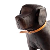 An Omersa and Co. Leather Dog Footstool