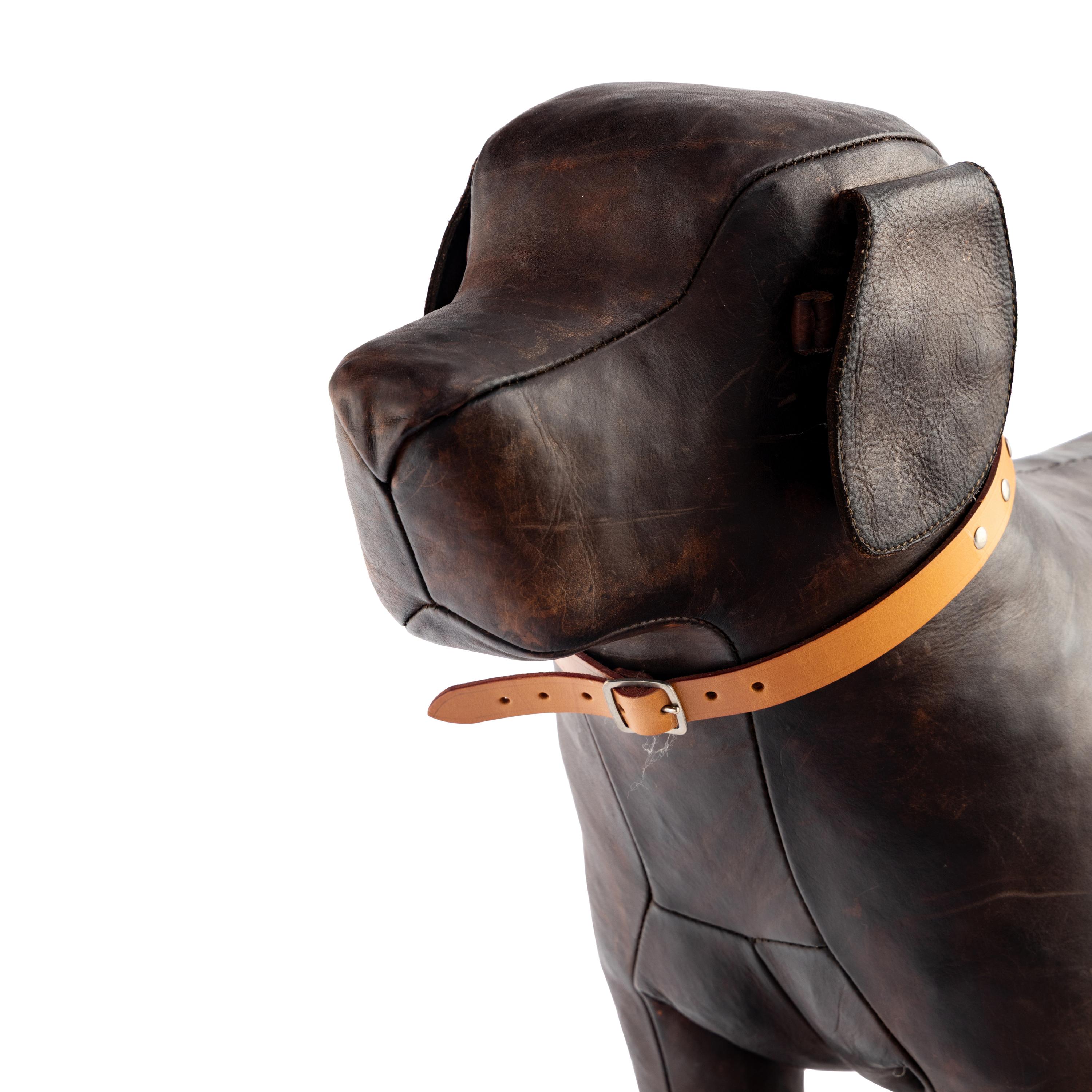 An Omersa and Co. Leather Dog Footstool