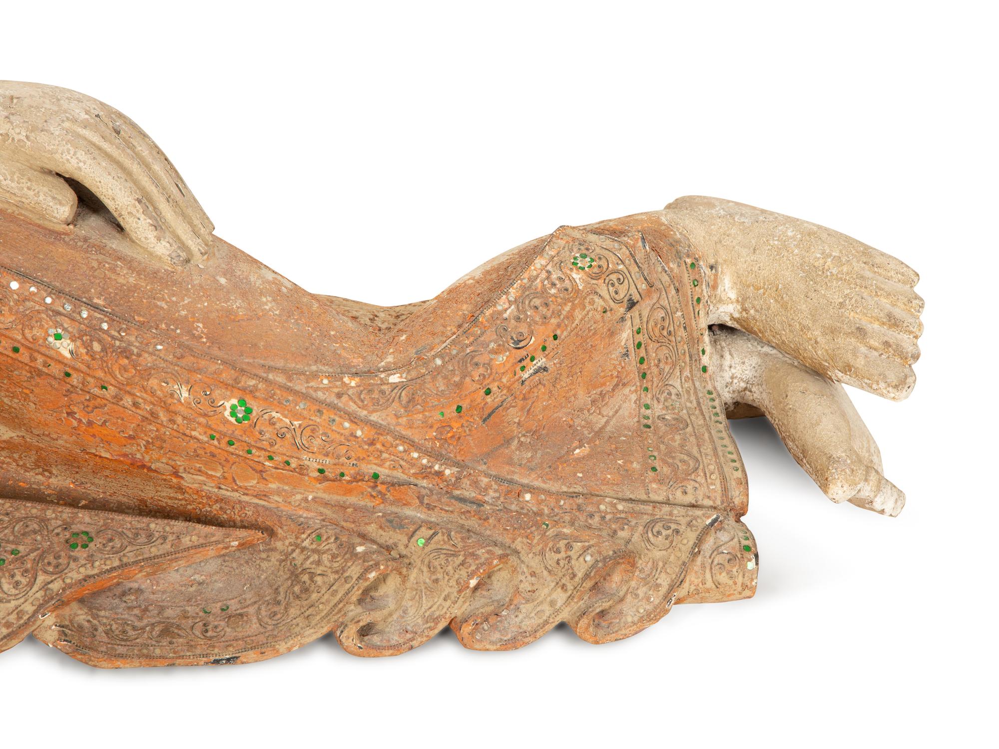 A South-East Asian Carved and Painted Wood Sculpture of a Reclining Buddha — 19th/20th Century