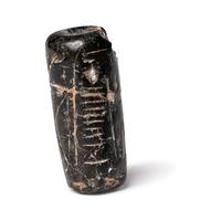 A Mesopotamian Black Steatite Cylinder Seal