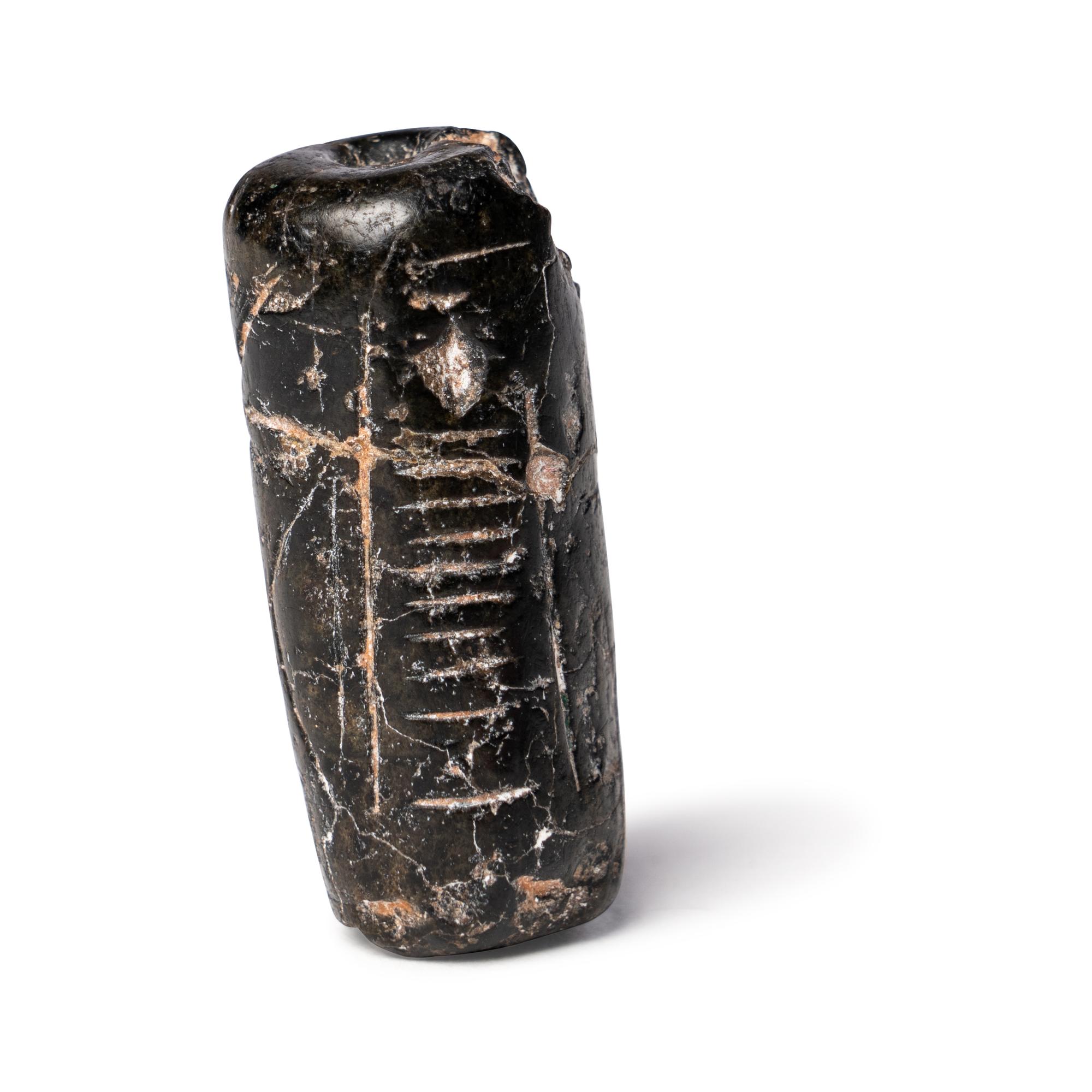A Mesopotamian Black Steatite Cylinder Seal