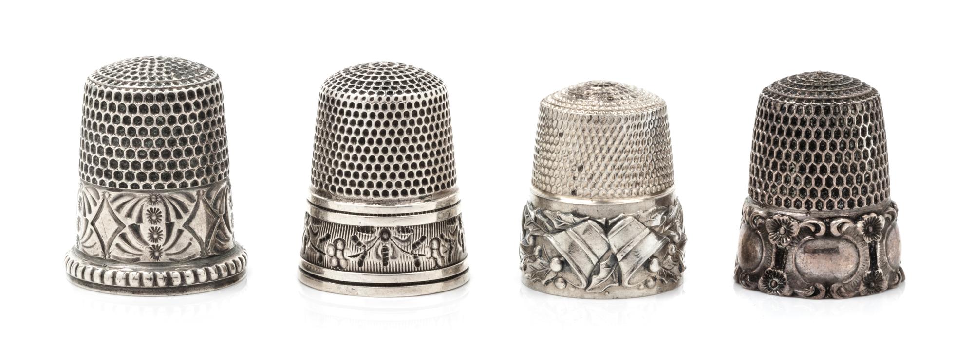 Four American Silver Thimbles, Simons Bros., Philadelphia, PA, compsiring a Holly & Bells restrike example; an example having a floral