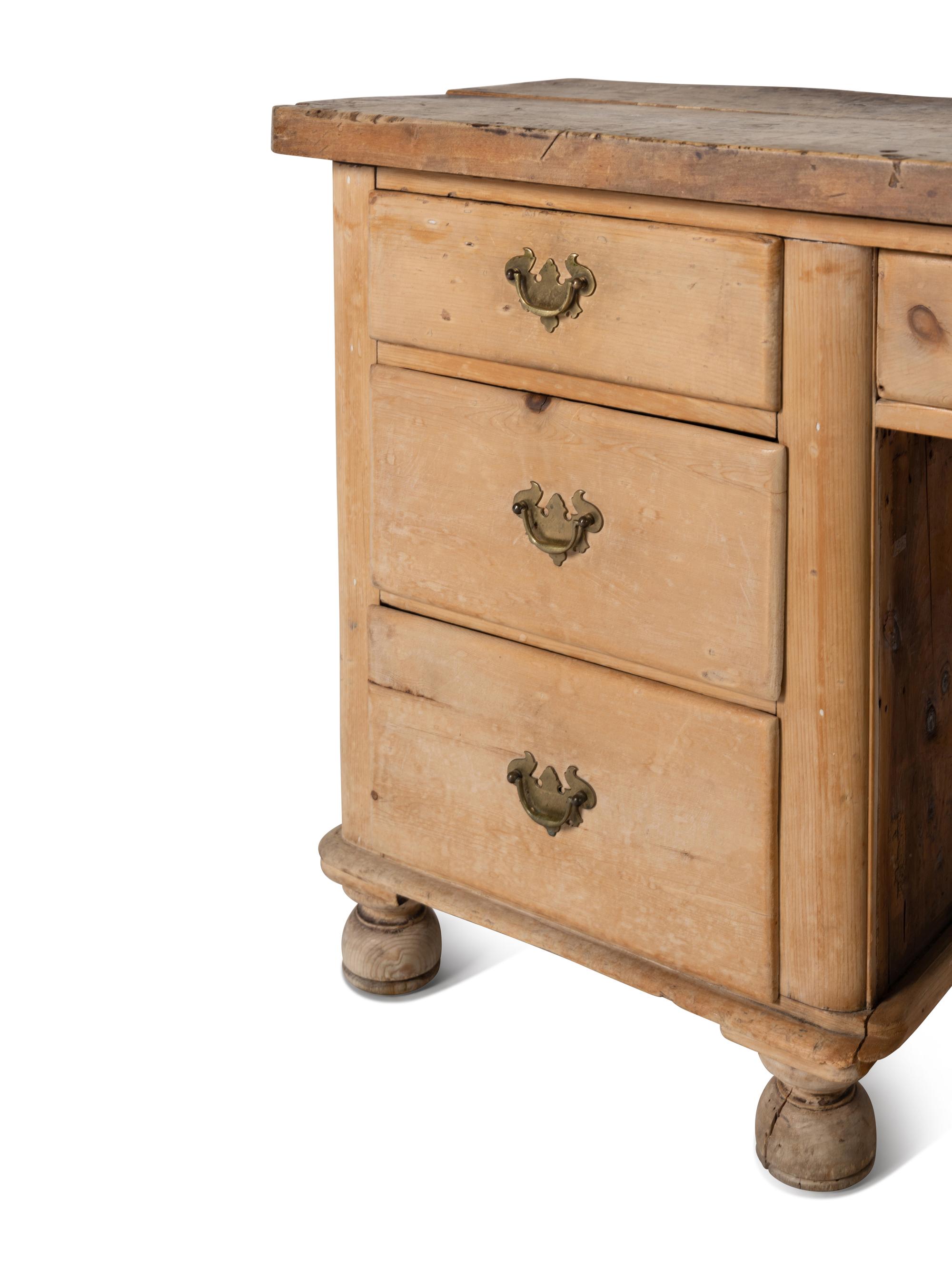 An English Pine Kneehole Dresser