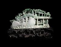 A Large Carved Apple Green and Celadon Jadeite Mountain