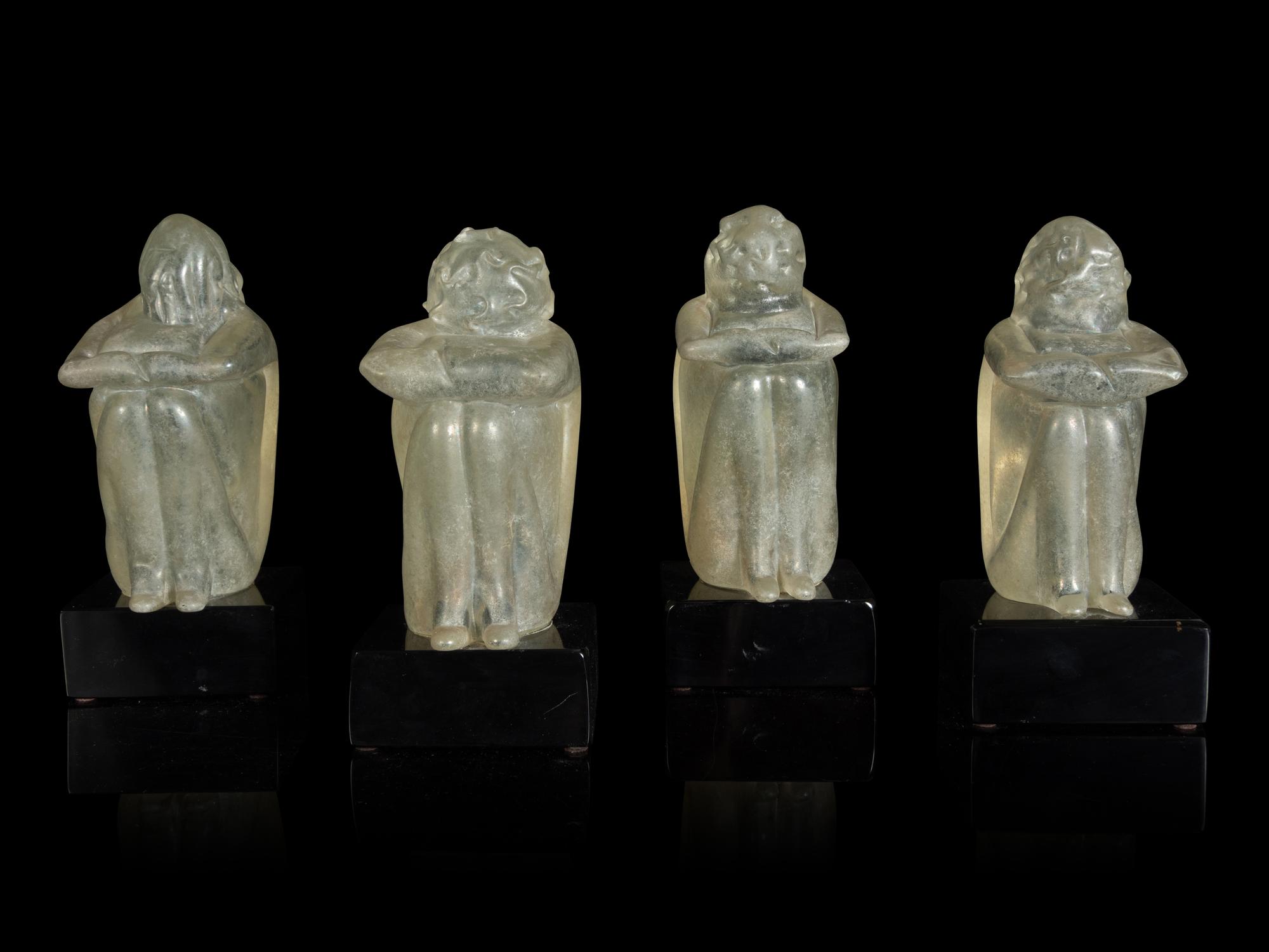 A Group of Four Glass Figural Groups