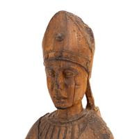 A Carved Walnut Figure of a Bishop