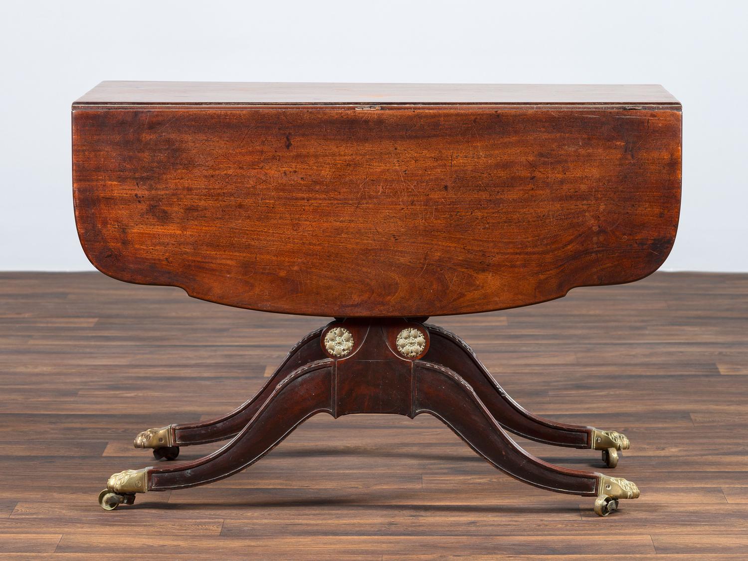 A Classical Brass-Mounted Walnut and Mahogany Pembroke Table