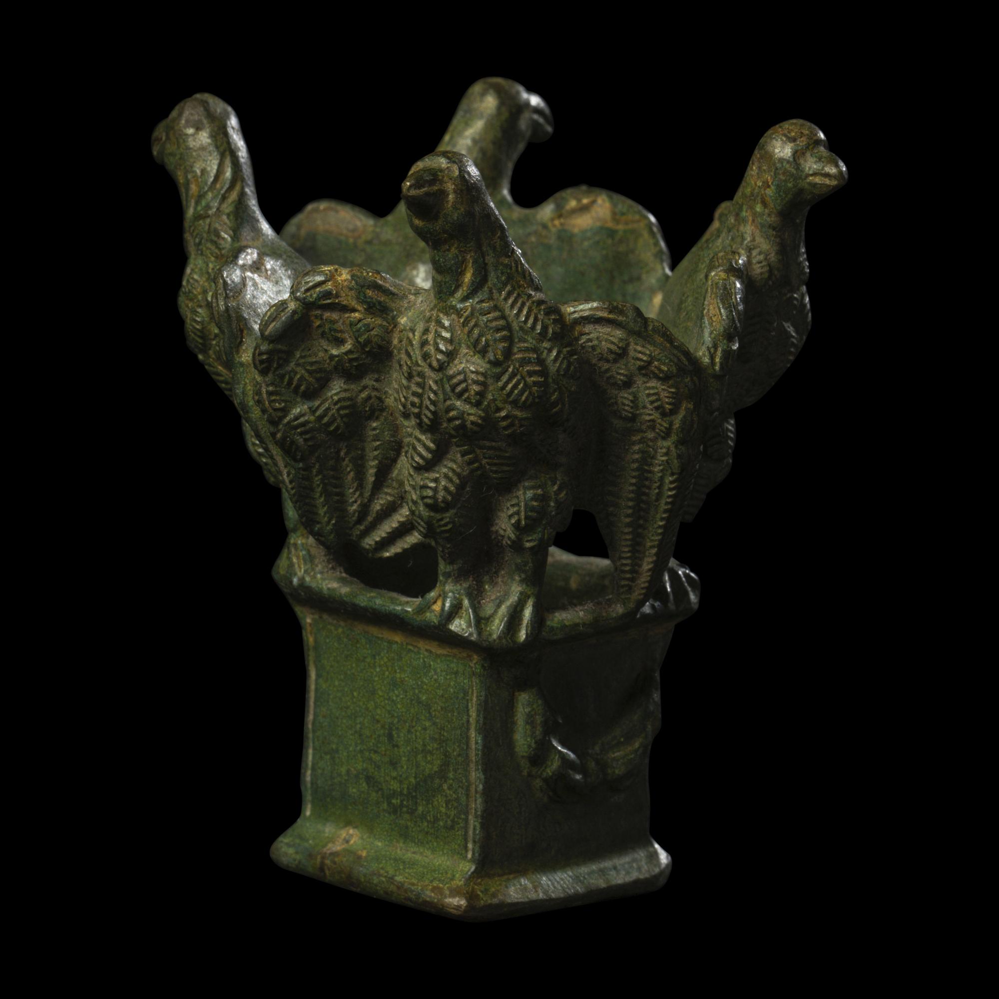 A Roman Bronze Lamp Stand with Four Eagles