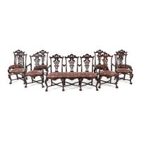 An Italian Rococo Style Carved Mahogany Nine-Piece Seating Suite