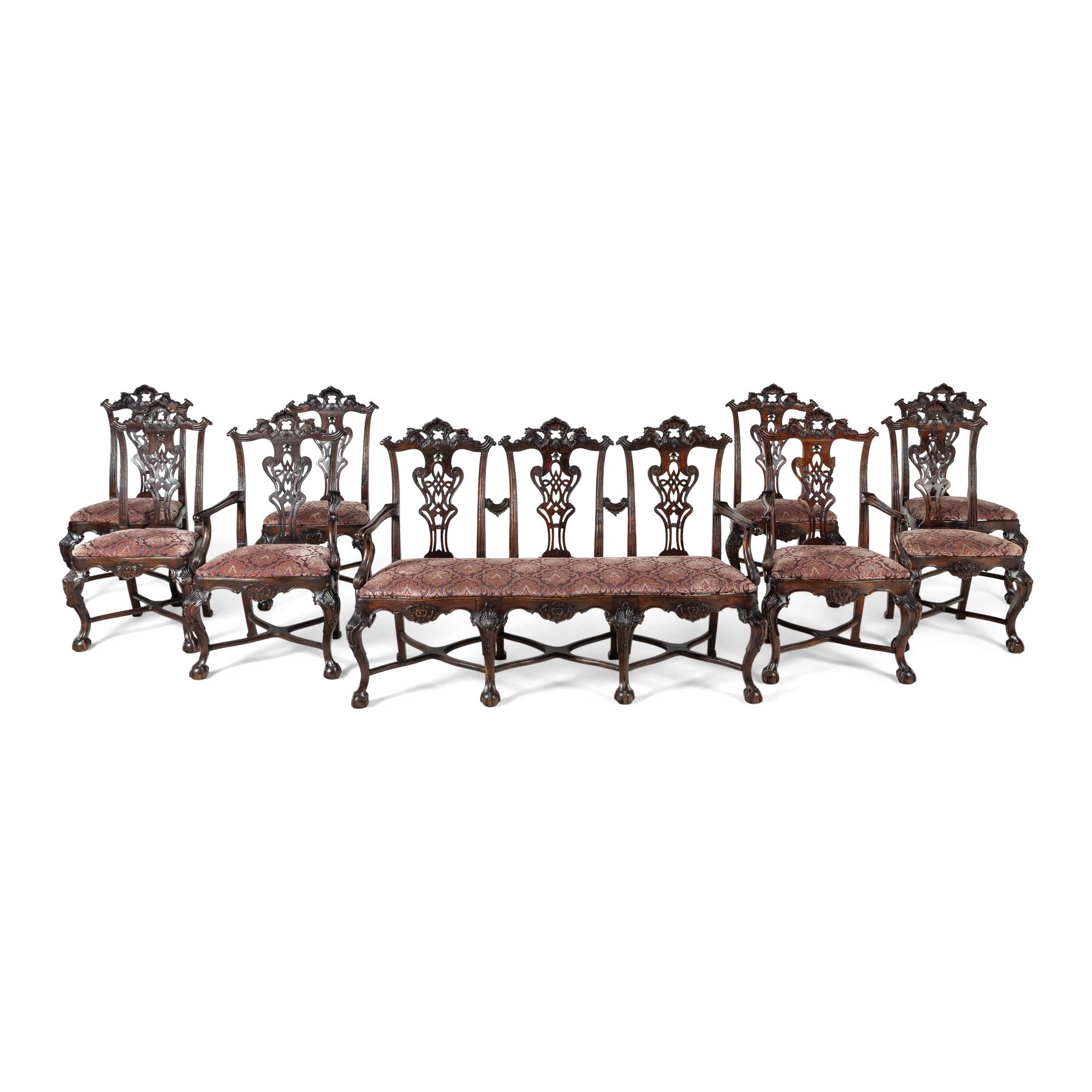An Italian Rococo Style Carved Mahogany Nine-Piece Seating Suite